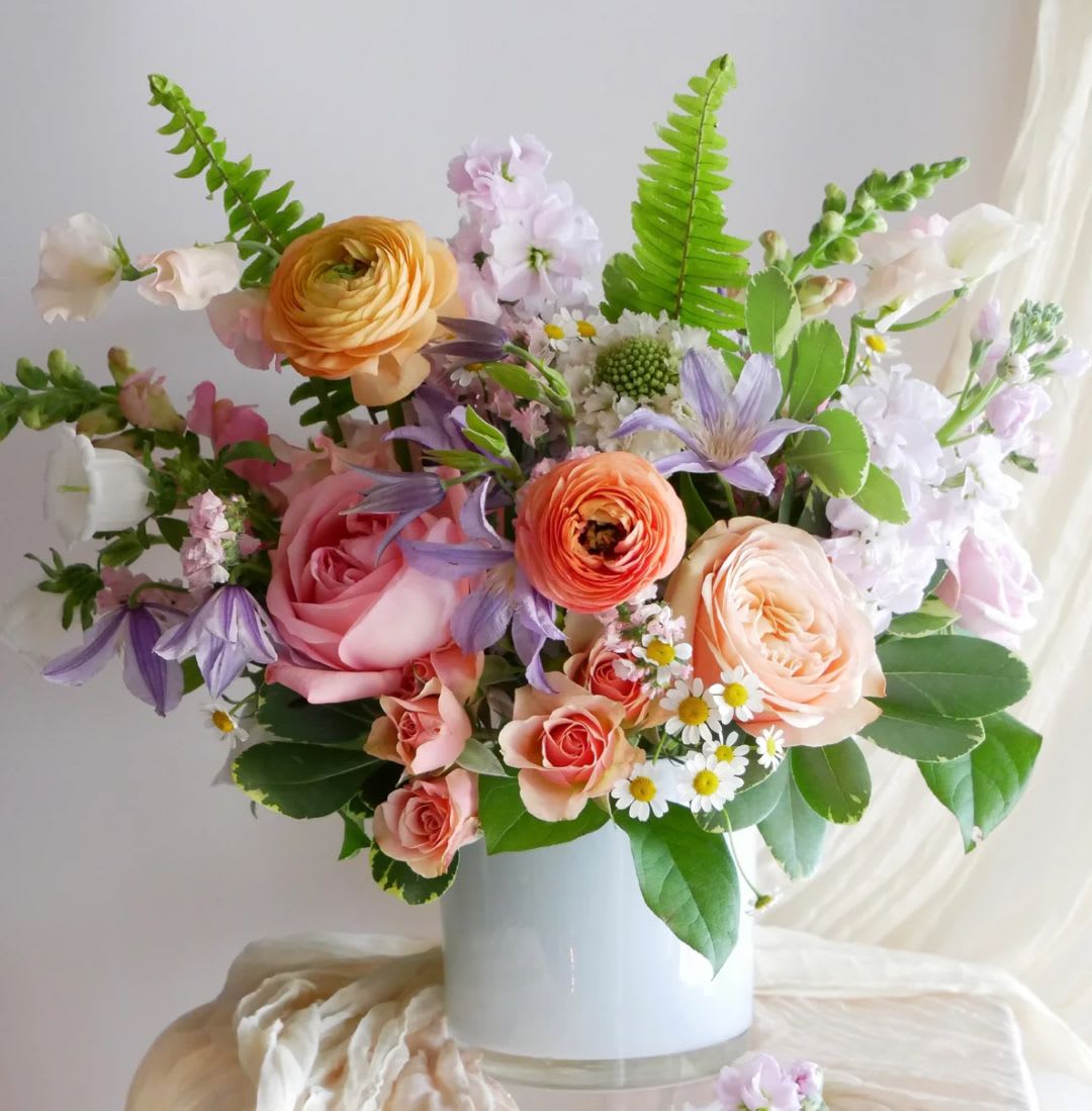 Designer’s Choice - PASTELS  - Soft, sweet, and effortlessly beautiful, Designer’s Choice Pastels is a fresh arrangement thoughtfully created with the season’s loveliest pastel blooms. Our designers hand-select a delicate mix of flowers in gentle shades of blush, lavender, peach, cream, and soft pink, blending textures and blooms to create a light and airy garden-inspired design.  Each arrangement is unique and crafted with care, allowing our designers to showcase the freshest flowers available that day. The result is a graceful bouquet that feels romantic, calming, and timeless—perfect for celebrations, thoughtful gifts, or simply brightening someone’s day.