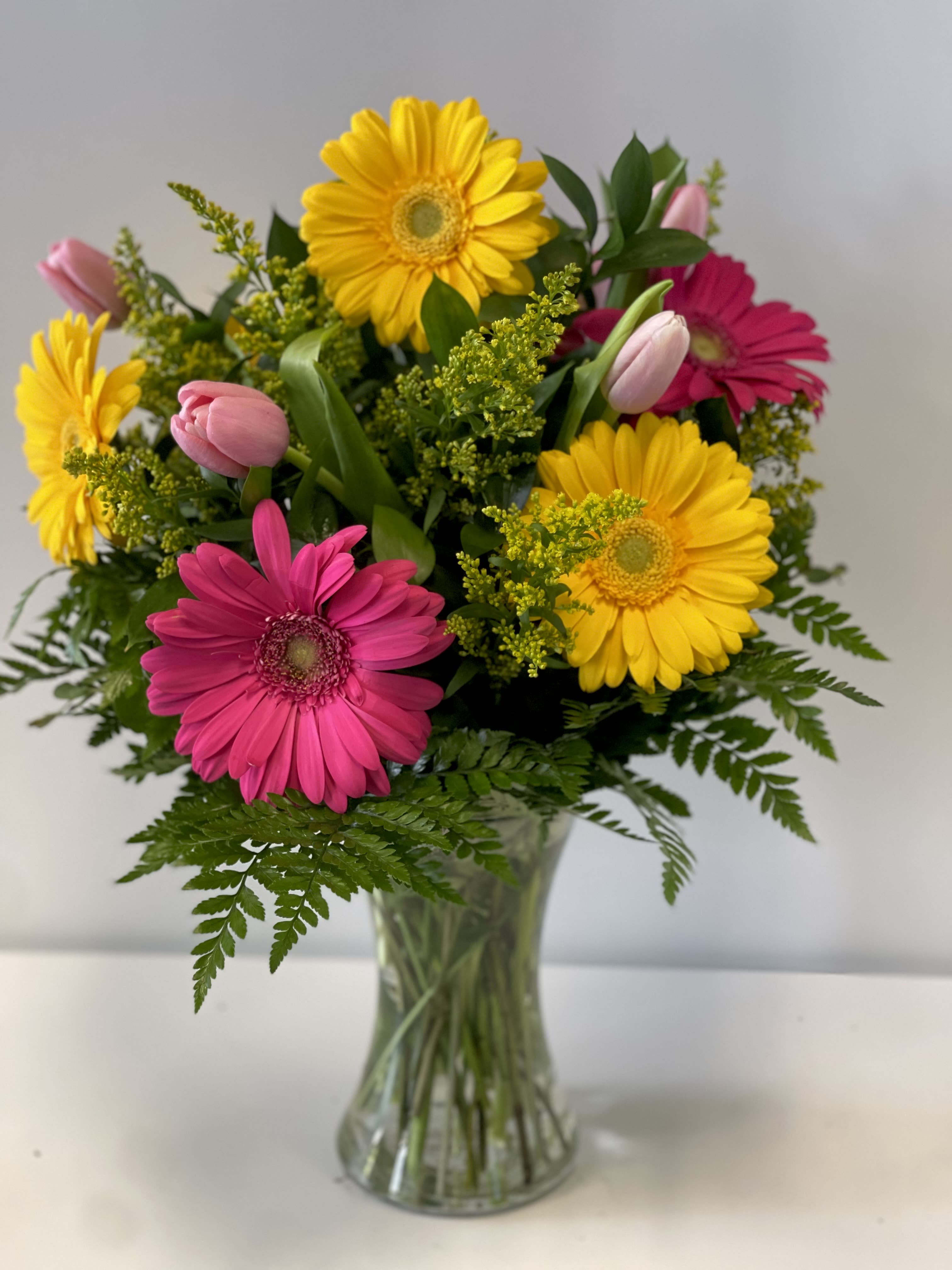 Mom’s Garden Daisies  - Vibrant colors of Gerbera daisies and tulips 