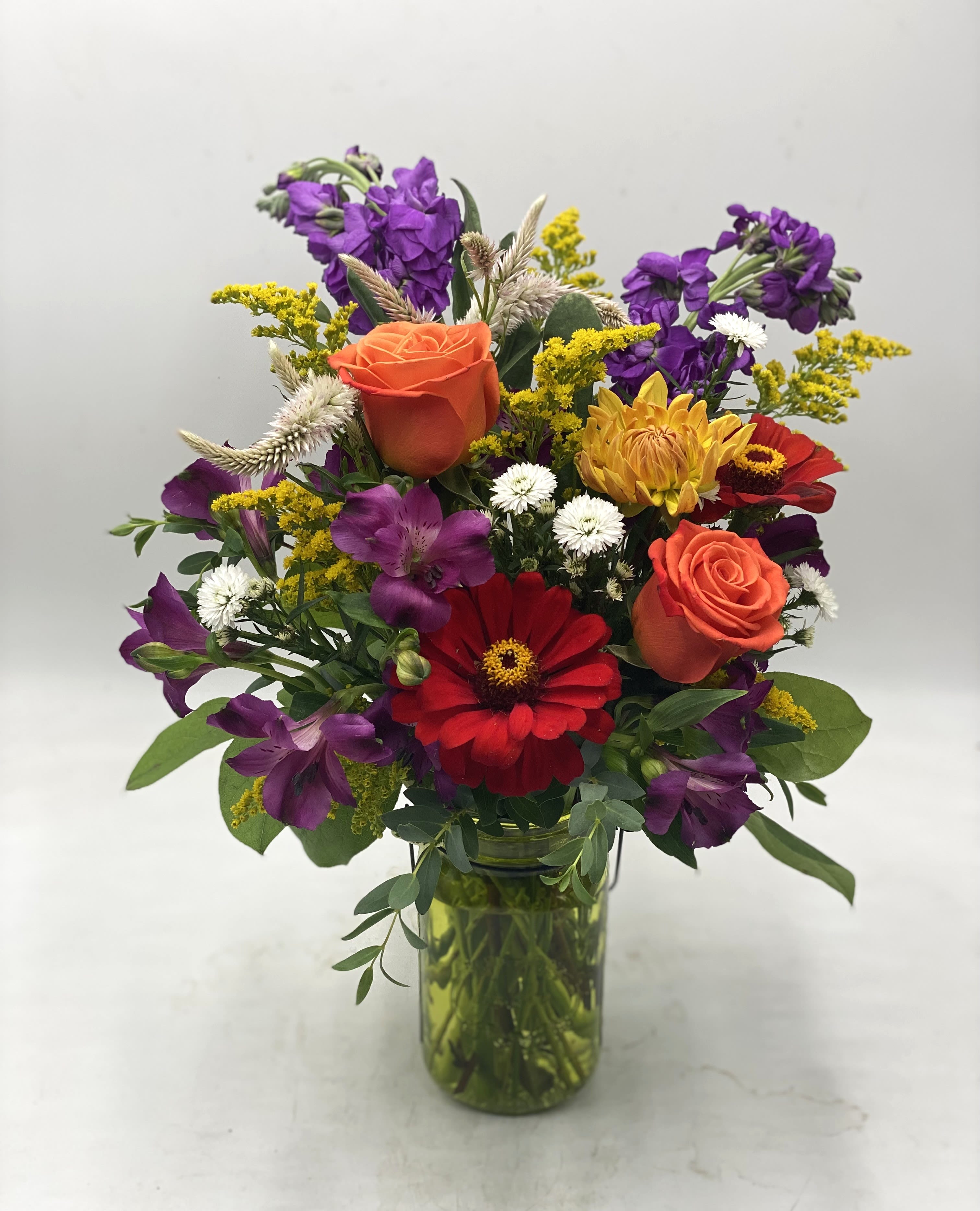 Handled Mason Jar Medley ** Designer Choice Mix ** - A mix of fresh, seasonal flowers designed in a handled mason jar ( Colors Vary! )