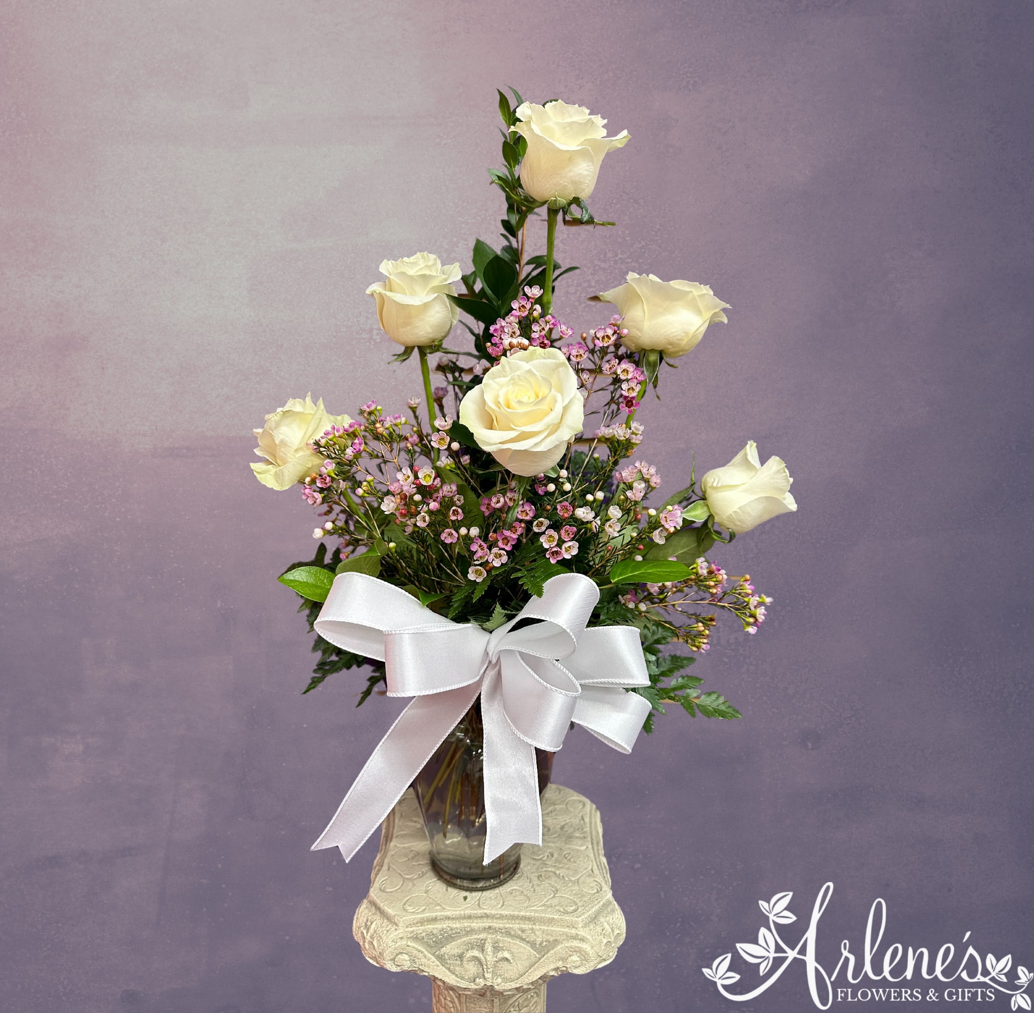 Half a Dozen White Roses - Six gorgeous cream roses in a vase with greenery, filler and a beautiful bow!