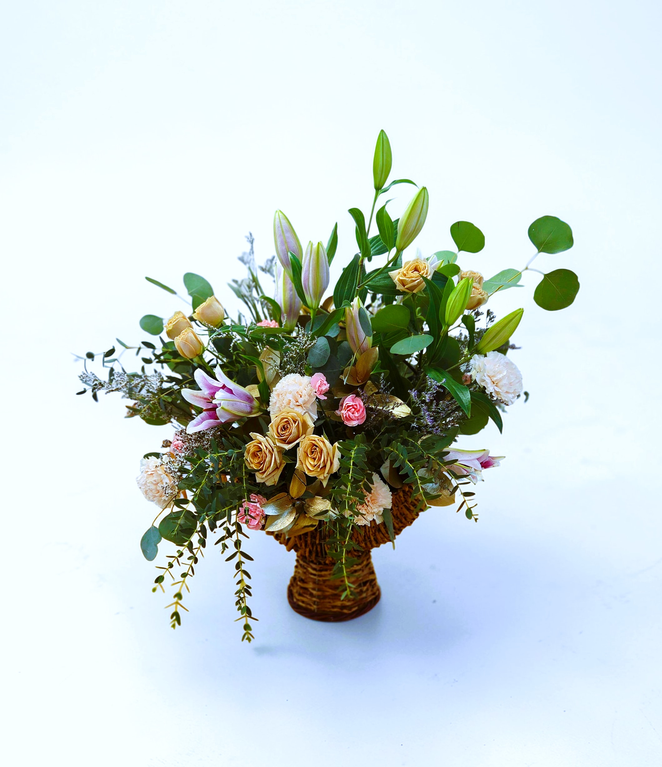 Giant Spring Basket  - This giant basket arrangement measures approximately 28 inches high and 24 inches wide. What a great way to make a big statement. Roses, lilies, and carnations make this arrangement both fragrant and gorgeous! With long lasting blooms and reusable basket this is a win! 