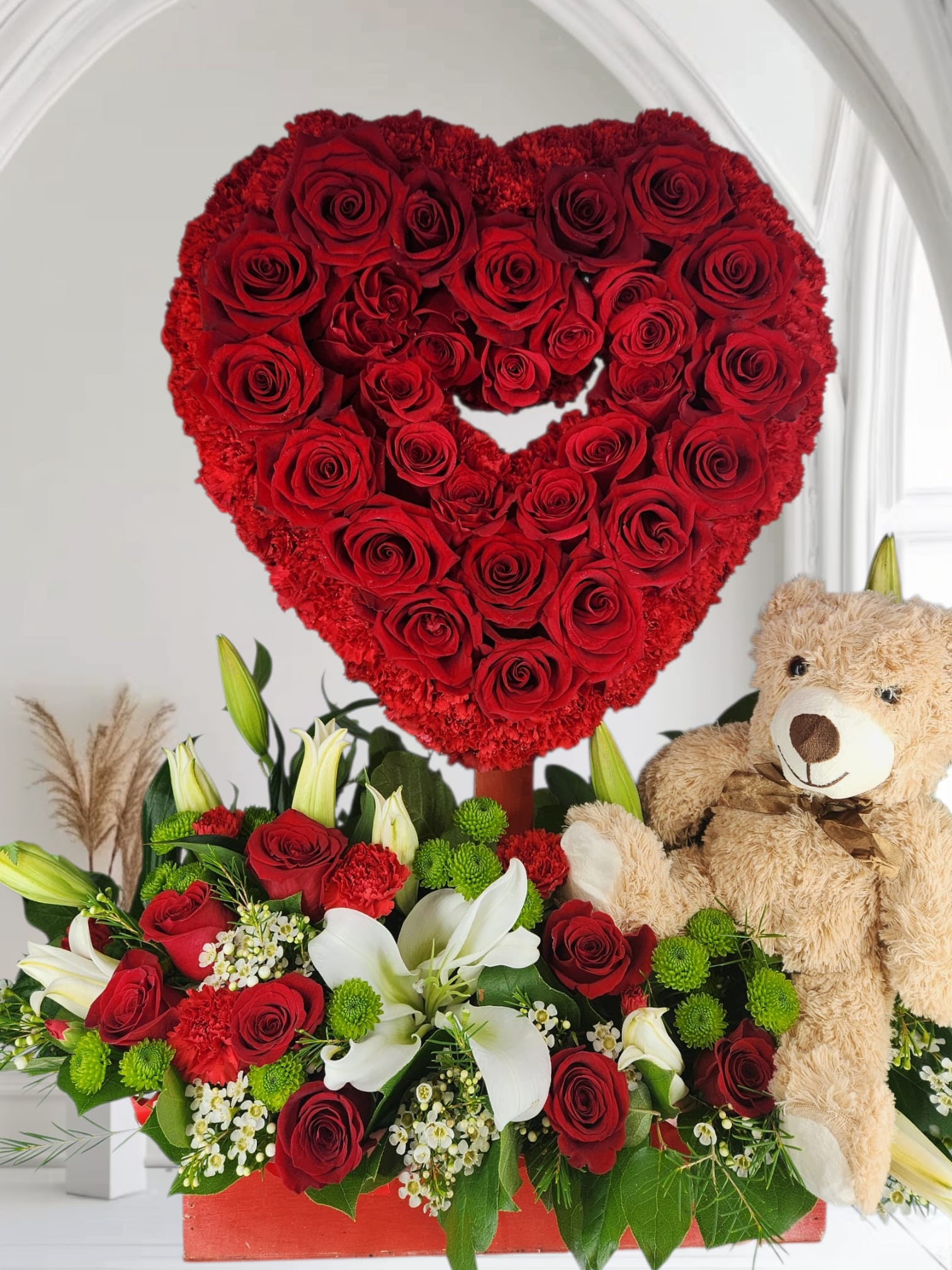 Heart Roses -  This stunning bundle features a breathtaking bouquet of classic red roses, fragrant stargazer lilies with teddy bear