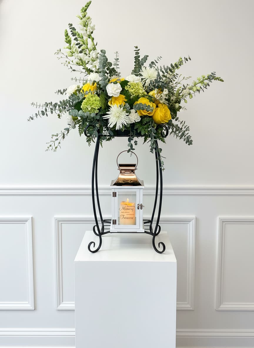 Beacon of Comfort - Beautiful and airy blooms sit atop a sympathy lantern. All flowers, colors, and lanterns may vary due to availability.