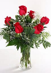 Half Dozen Red Roses - A beautiful assortment of 6 red roses with baby's breath and greens. All roses, colors, and containers are subject to change due to availability.