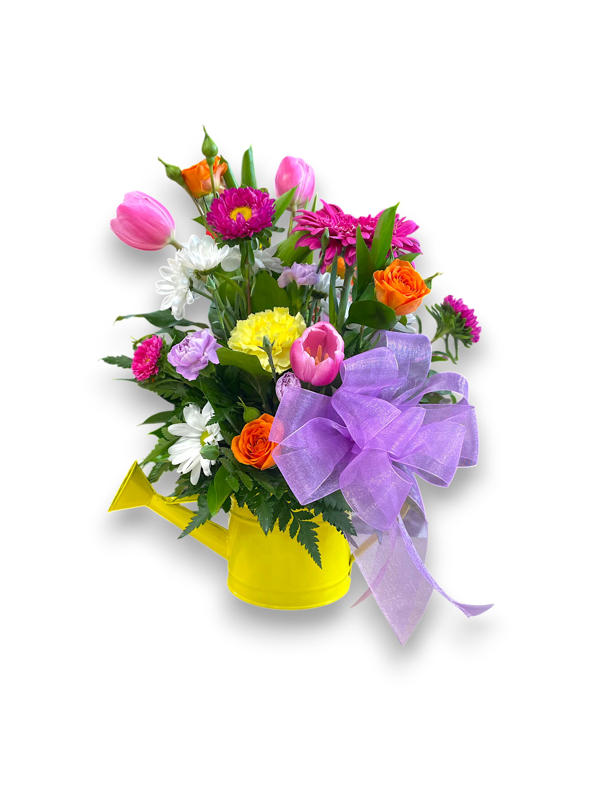 April Showers Arrangement - Arranged in a charming watering can (that is fully functional), this bouquet features bright &amp; colorful blooms including, pink tulips, spray roses, and a gerbera daisy. Bursting with color and cheer, it brings a lively, uplifting vibe that is perfect for welcoming the season and rejoicing in spring’s renewal.  Colors and blooms may vary based on seasonal availability. 