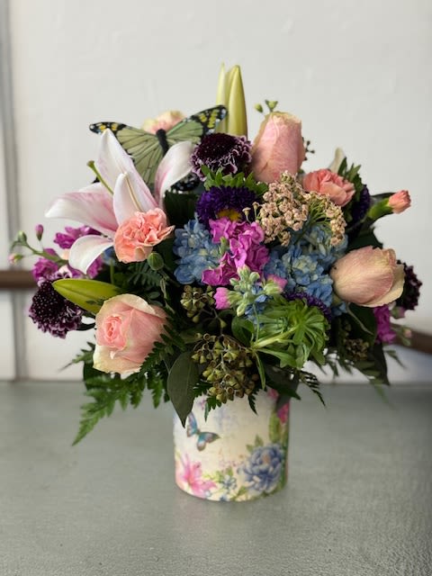 Butterfly cutie - pastel flowers with a butterfly in a butterfly container