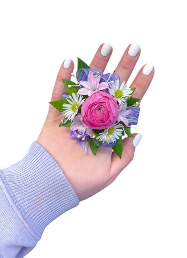 Custom Hand Corsage - Introducing our new Hand Corsage! A modern spin on the classic corsage, thoughtfully designed to be worn gracefully on your hand. This stylish floral accessory is perfect for those who want something a little different from the traditional wrist corsage, while still expressing their unique style. Personalize your hand corsage by choosing your preferred blooms, ribbon, greenery, and a touch of bling. It’s a beautiful, custom floral accent that brings a delicate and elegant finishing touch to your look!  If ordering online, please indicate your color and bloom preferences in the 'Special Instructions' section during checkout, Thank you!