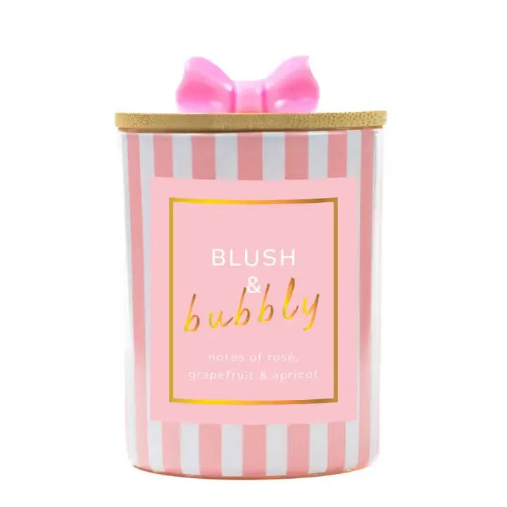 Pink striped candle jar with a bow-shaped lid
