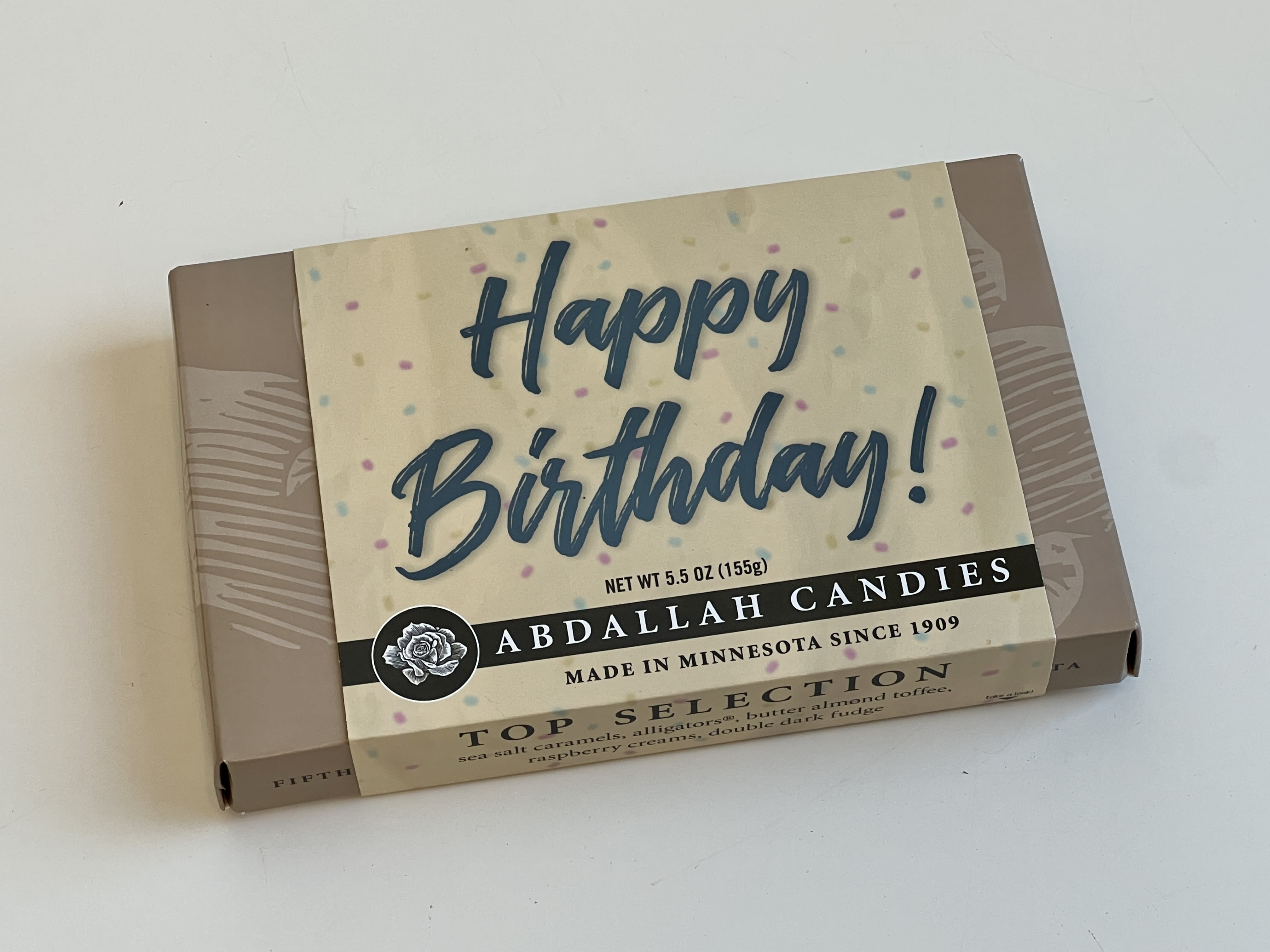 Birthday candy gift box on a white surface
