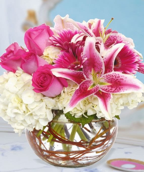 Vibrant Elegance - Beauty and Cheer exude from this graceful arrangement.  Sure to please.