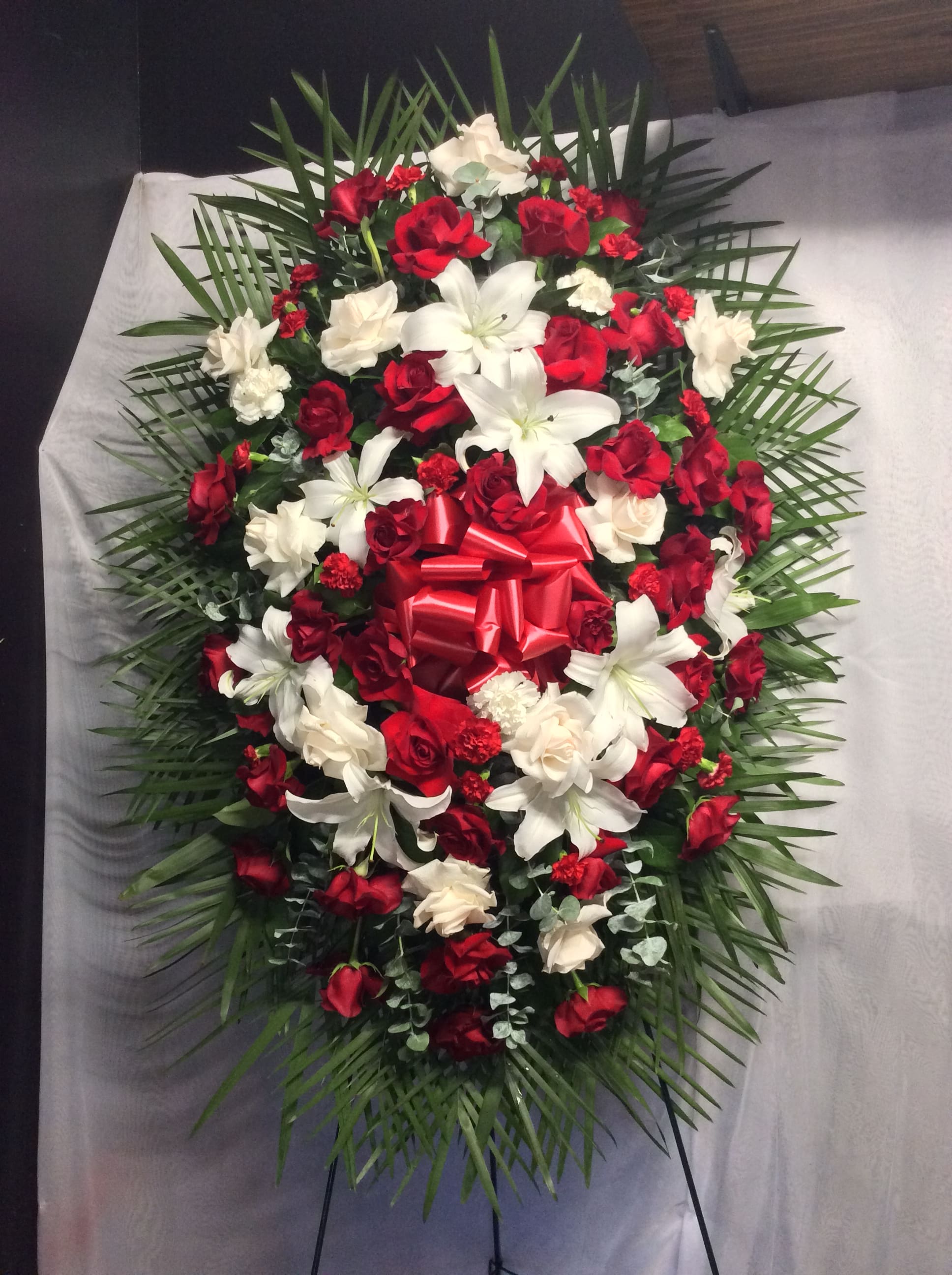 Red &amp; white lovely standing spray  - Beautiful standing spray with red roses, white roses, white lilies and carnations 