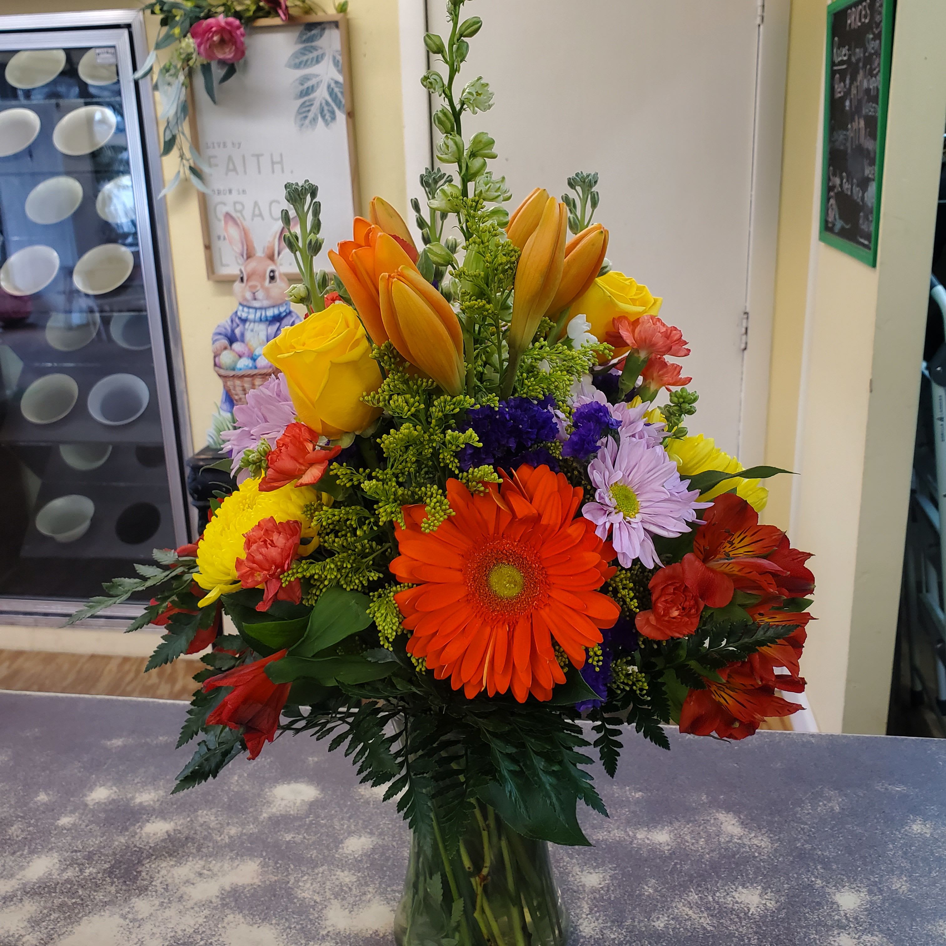 Spring Days  - A glass vase filled with assorted spring flowers.  A colorful combination. Sure to make someone smile!
