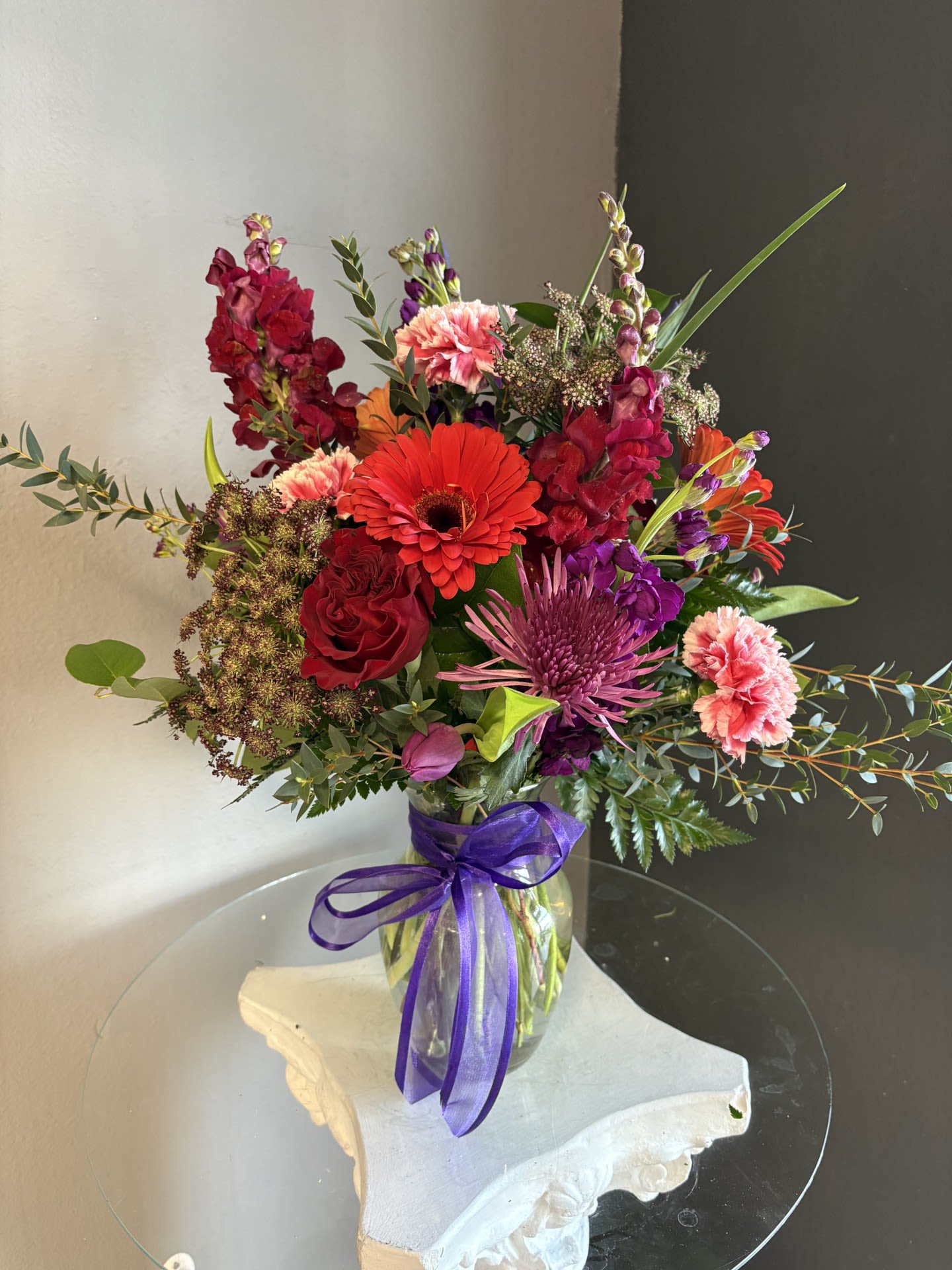 #709 Designer's Choice Vase Arrangement - This beautiful flower arrangement of fresh mixed seasonal blooms is made by local designers in the heart Orange California. Hand crafted and perfect for every occasion, from birthdays and new babies to sympathy and just because. The best choice to show you are thinking of that special someone. Can be sent as a local delivery or in-store pickup. This is an original, one of a kind arrangement. Order now before it's too late!