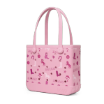 Bogg Bag Baby - Bogg n' Boots - Meet the mid-sized tote that does it all. The Baby Bogg Bag is a durable, washable, and tip-proof carryall—perfectly sized for everyday adventures.  Smaller than the Original but still spacious, this versatile tote fits your personal essentials without the bulk. Use it as a gym bag, pool bag, or day bag—it’s lightweight, easy to clean, and built to last.  Includes a small insert pouch for must-haves like your phone, keys, or lip balm—because the little things matter, too.  Best for: Everyday use, short outings, personal essentials, and on-the-go moments.