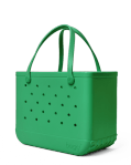 Bogg Bag Original - Green With Envy - The bag that started it all—washable, indestructible, and built to carry it all. The Original Bogg Bag is our largest, most spacious tote—perfect for beach days, big hauls, and everyday family adventures.  Durable and tip-proof, it stands upright, wipes clean, and keeps up with whatever your day throws at it. Sand brushes off. Spills don’t stick.  Includes two clear insert bags—perfect for organizing smaller essentials like your phone, sunscreen, keys, or snacks.  Pair it with our full line of Bogg accessories—dividers, toppers, coolers, makeup bags, and more—to build your ultimate carryall kit.  Best for: Beach trips, travel days, family outings, and everything in between.