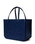 Bogg Bag Original - You Navy Me Crazy - The bag that started it all—washable, indestructible, and built to carry it all. The Original Bogg Bag is our largest, most spacious tote—perfect for beach days, big hauls, and everyday family adventures.  Durable and tip-proof, it stands upright, wipes clean, and keeps up with whatever your day throws at it. Sand brushes off. Spills don’t stick.  Includes two clear insert bags—perfect for organizing smaller essentials like your phone, sunscreen, keys, or snacks.  Pair it with our full line of Bogg accessories—dividers, toppers, coolers, makeup bags, and more—to build your ultimate carryall kit.  Best for: Beach trips, travel days, family outings, and everything in between.