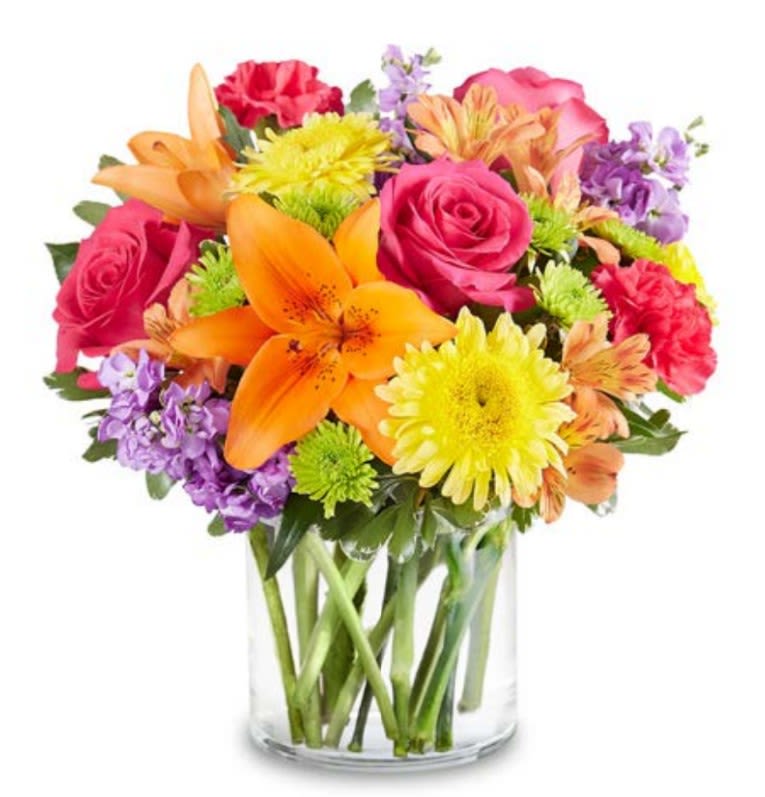 Sunshine &amp; Sangria - Toast to any occasion with Sunshine &amp; Sangria! This spirited arrangement captures the warmth of a summer afternoon with a bold mix of radiant yellow daisies and lush, wine-colored magenta carnations. Accented with deep purple blooms and fresh garden greens, it’s a refreshing and colorful centerpiece that brings a cheerful "happy hour" vibe to any room. Perfect for birthdays, thank-yous, or just to brighten someone’s day.