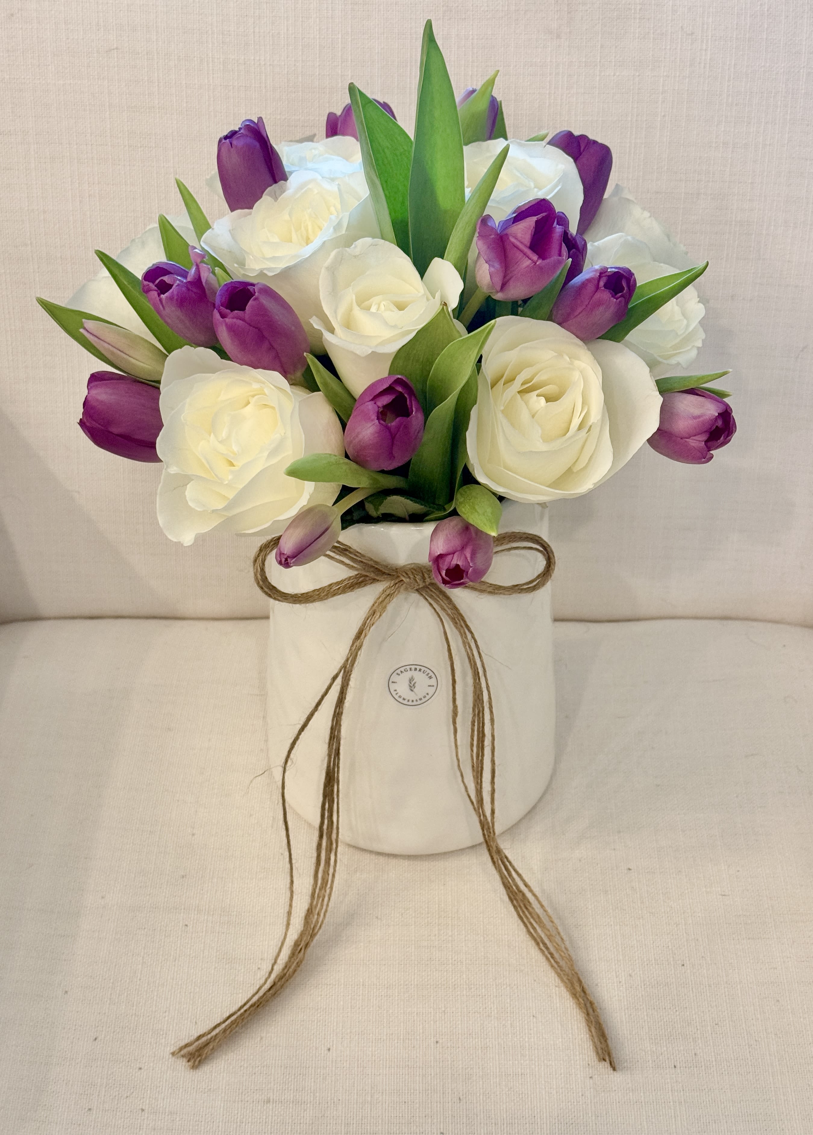 Tulips and Roses  - A gorgeous arrangement with tulips and roses in a ceramic or glass vase depending on availability. Various colors available. 