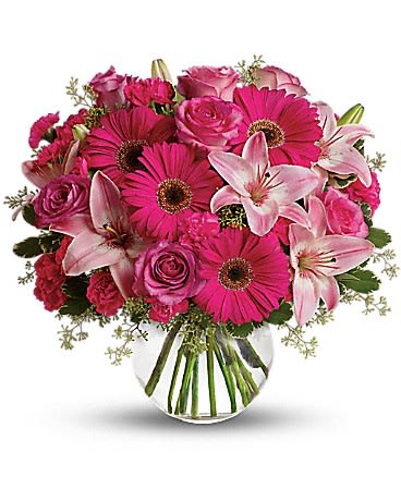 A Little Pink Me Up - Sometimes all you need is a little pink me up! An ideal pick for anyone whose favorite color is pink, this stylish mix is full of variety and comes presented in a clear glass bubble bowl they'll use again and again. •A wide variety of flowers including pink roses, pink asiatic lilies, hot pink gerberas, pink carnations and hot pink miniature carnations are mixed with fresh variegated pittosporum and seeded eucalyptus. •Presented in a gorgeous glass bubble bowl. •Orientation: All-Around 