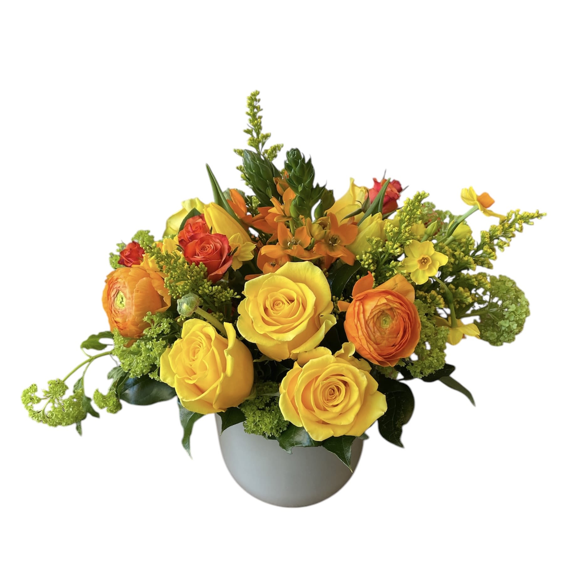 Garden of Grace - Yellow roses, orange ranunculus, orange sun star, orange spray roses, viburnum, tulips, and mini daffodil's designed in a light grey glass vase as shown in photo.  