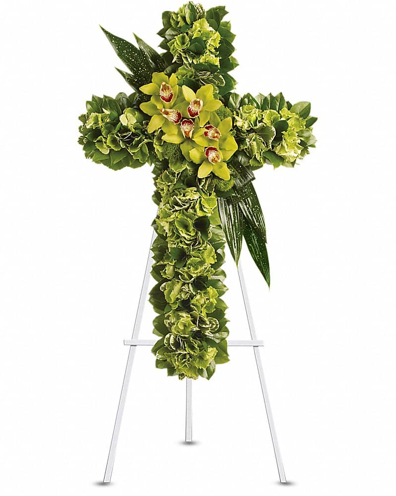 Heaven's Comfort - A life-affirming gift of faith and hope is always appreciated in a family's darkest hours. This elegant cross delivers that message in a way that will touch many hearts. Green hydrangea along with a dazzling mix of exotic green flowers and leaves create a beautiful and textured cross, delivered on an easel.