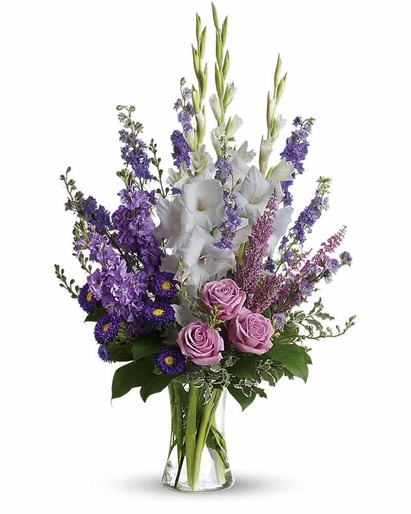 Joyful Memory - Lavender and white sympathy flowers make a grand statement in this joyful bouquet. Cherish your memories with this lasting remembrance of lavender larkspur and roses, deep purple asters, pure white gladioli and the softest pink heather. A classic assortment of flowers such as lavender larkspur, stock and roses, plus purple asters, white gladioli and pink heather.