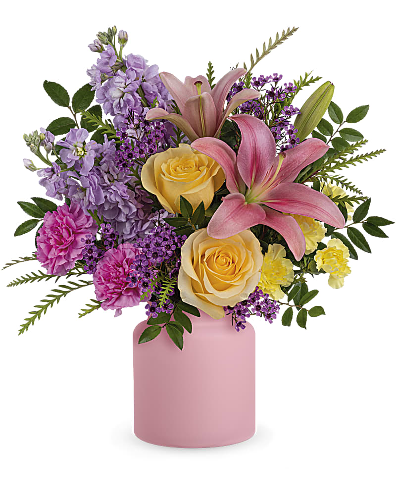 Teleflora's Cheerful Gift Bouquet - A most cheerful gift, this colorful bouquet of roses and lilies is artfully arranged in a darling frosted glass jar. Pink asiatic lilies, light yellow roses, hot pink carnations, miniature yellow carnations, lavender stock and lavender waxflower are accented with huckleberry and grevillea. Delivered in Teleflora's Savannah Jar.
