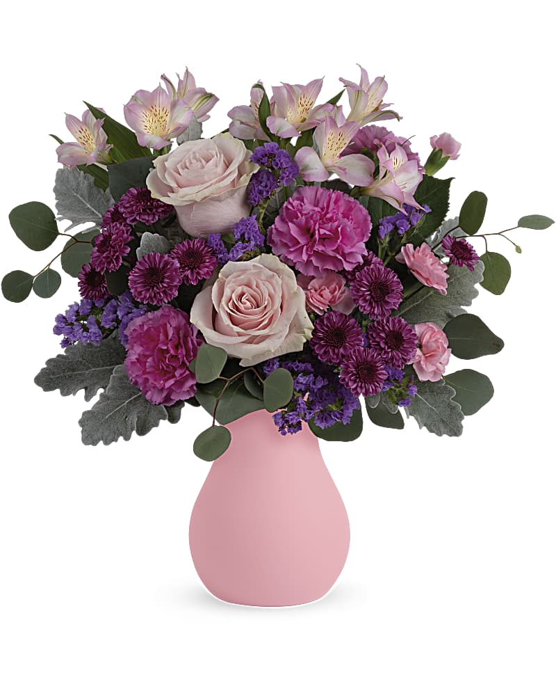 Teleflora's Cotswald Garden Bouquet - Like a walk through an English garden, this breathtaking bouquet of soft pink roses in a frosted glass vase delights and inspires. Pink roses, pink alstroemeria, purple button spray chrysanthemums, hot pink carnations and lavender sinuata statice are arranged with dusty miller and silver dollar eucalyptus. Delivered in Teleflora's Serendipity Glass Vase.