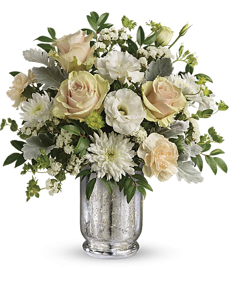Teleflora's Endless Lovelies Bouquet - Arranged in a vintage-inspired mercury glass hurricane, this gorgeous array of soft peach roses and delicate white lisianthus has a timeless appeal anyone will adore. Later, add a votive to the hurricane for a sparkling glow. This lovely arrangement includes peach roses, peach carnations, white lisianthus, white cushion spray chrysanthemums, white sinuata statice, bupleurum, dusty miller, and huckleberry. Delivered in a Silver Mercury Glass Hurricane.
