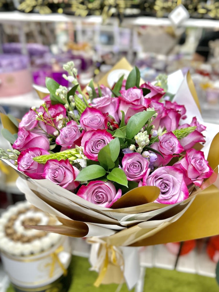 2 Dozen Beauty Handheld Bouquet - Lavender Roses - 2 Dozen Beauty Handheld Bouquet, Round Style: 2 dozen hand picked roses, wax, alstros, and greens nicely wrapped eurostyle accented with a ribbon. Quick and easy flower gift. (NO VASE INCLUDED)