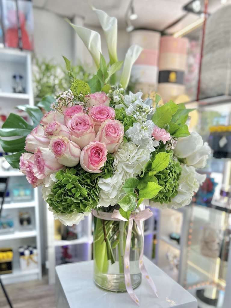 Amore Eterno Roses Bouquet - Light Pink - Amore Eterno Roses Bouquet: 3 doz. roses, hydrangeas, fillers, greens, and orchids placed in a beautiful clear cylinder / square vase decorated with stylish ribbon