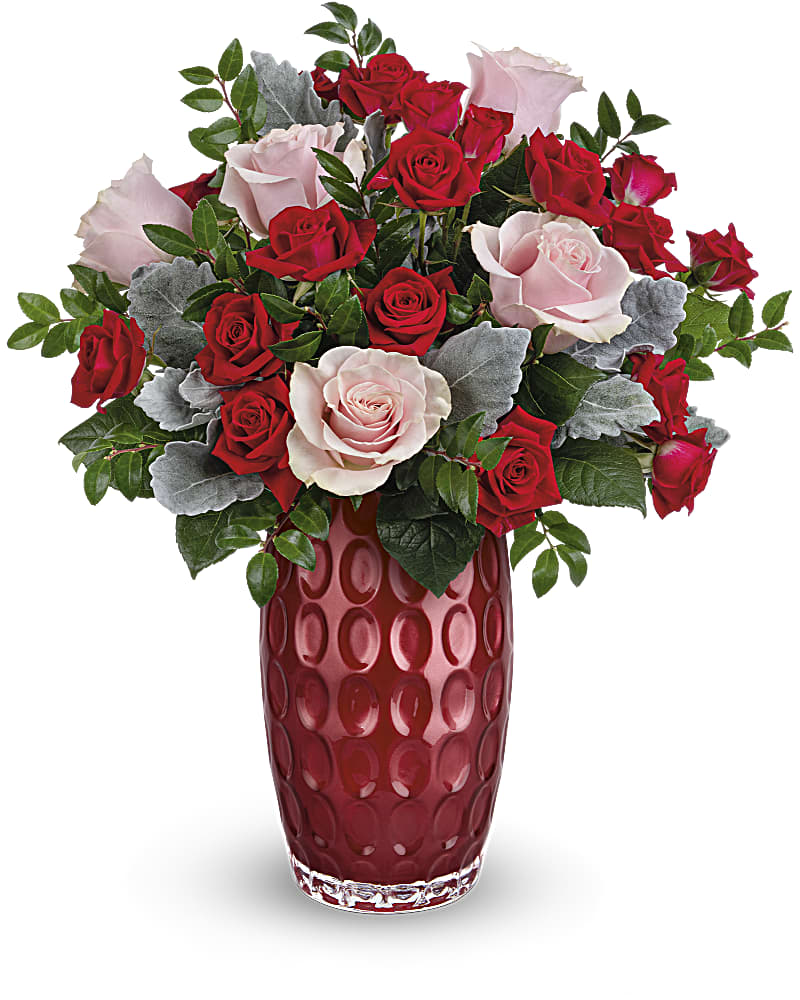 Teleflora's Love Always Bouquet - Forever has never looked more fabulous than this charming pink and red rose bouquet, arranged in a pearlescent glass vase with modern debossed pattern. Pink roses and red spray roses are accented with dusty miller and huckleberry. Delivered in a Love Always Vase.