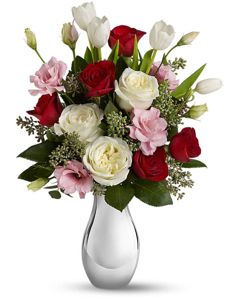 Teleflora's Love Forever Bouquet with Red Roses - Tickle her heart with this flirtatious mix of romantic roses, lisianthus and tulips. This bouquet is arranged in our elegant Silver Reflections vase. It's a vase she's sure to hold on to - and it'll always remind her of you. This feminine bouquet features large white and red roses, delicate pink lisianthus, elegant white tulips and seeded eucalyptus and comes delivered in our exclusive Silver Reflections vase, a metalized ceramic vase with a light pink tone.