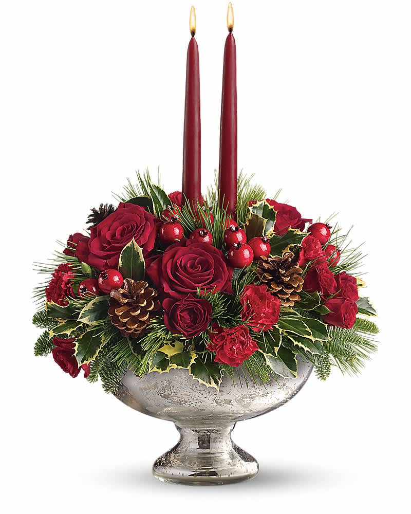Teleflora's Mercury Glass Bowl Bouquet - Invited to a holiday gathering? Help set the mood and the table by sending this festive holiday centerpiece a day or two before the event. Your hosts will be impressed and incredibly grateful. Plus, they'll be able to use the stunning mercury glass bowl for years to come. Beautiful red roses, spray roses, carnations and berries are arranged with pine and fir branches, pinecones and holly. Two elegant taper candles complete this perfect arrangement.
