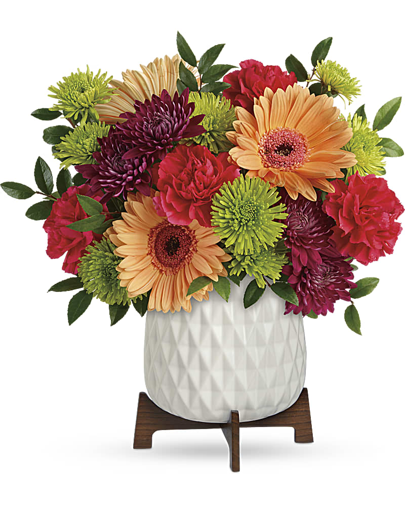 Teleflora's Mid Mod Brights Bouquet - Two gorgeous gifts in one! Celebrate any occasion with this bouquet of bright blooms, stylishly presented in a mod mid-century ceramic planter keepsake! This bright bouquet features hot pink roses, peach gerberas, hot pink carnations, green cushion spray chrysanthemums, purple cushion spray chrysanthemums, and huckleberry. Delivered in a Mid Mod Geometric Planter.