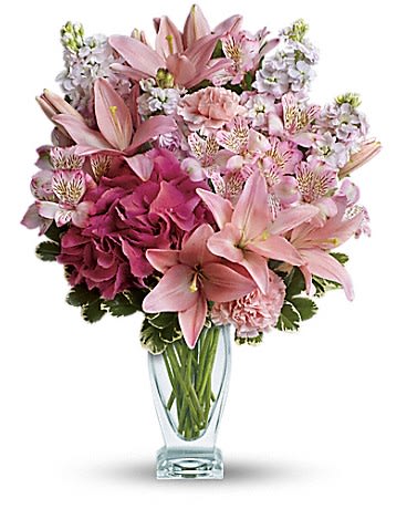 Blush Of Love Bouquet - Make her blush with this romantic mix of fragrant lilies and lush hydrangea in dreamy shades of pink. Presented in our elegant couture glass vase, this beautiful bouquet is affection perfection!