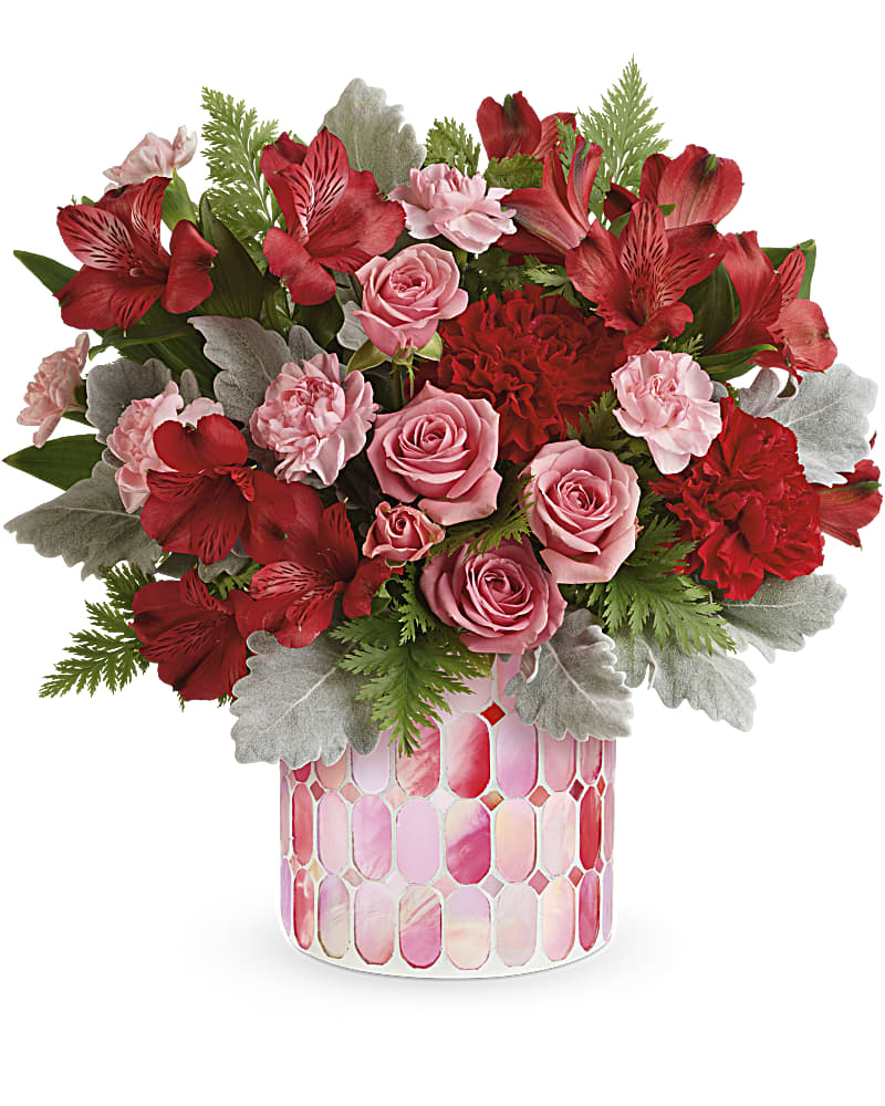 Teleflora's Precious in Pink Bouquet - Everyone's crushing on this precious petal-filled gift! Bursting with classic red and pink blooms, this magnificent mosaic vase of pink stained glass is sure to make their heart flutter. This bouquet includes pink spray roses, red alstroemeria, red carnations, miniature pink carnations, dusty miller and leatherleaf fern. Delivered in a Precious in Pink cylinder.