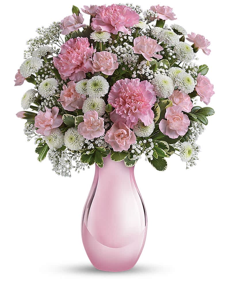 Teleflora's Radiant Reflections Bouquet - Hurray for pink! Celebrate your sweet one with this sentimental bouquet - a delightfully pink mix of pink and white blooms presented in a keepsake Pink Reflections vase she'll cherish always. Pink carnations, white button chrysanthemums and million star gypsophila are accented with fresh greens. Delivered in a Pink Reflections vase.