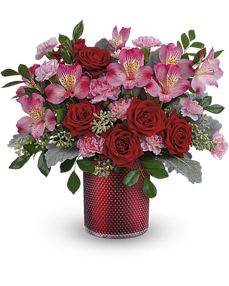 Teleflora's Scarlet Diamond Bouquet - Shimmering in scarlet with an elegant embossed diamond pattern, this glorious glass vase turns this pink and red rose bouquet into an unforgettable Valentine's Day surprise. This arrangement includes red spray roses, pink alstroemeria, miniature light pink carnations, dusty miller, seeded eucalyptus and huckleberry. This red and pink bouquet is delivered in a Scarlet Diamond Cylinder.