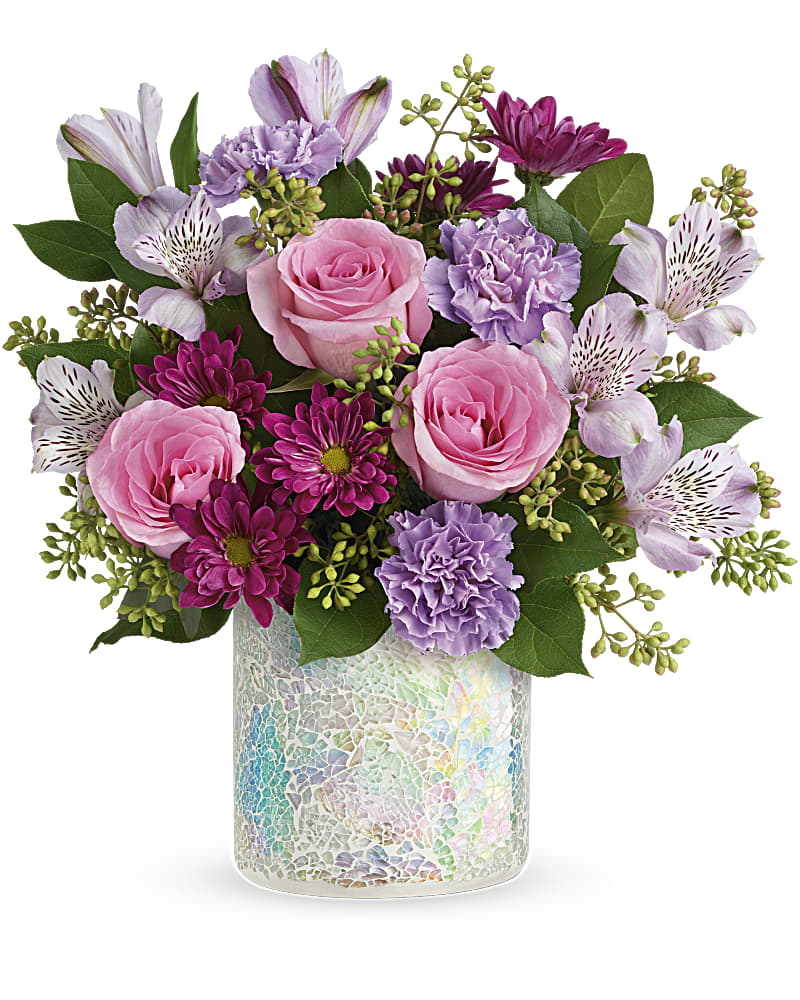Teleflora's Shine In Style Bouquet - Shimmer and shine! Nothing will make mom's eyes sparkle quite like this iridescent, mosaic glass vase bursting with the prettiest pink and lavender bouquet! This gorgeous bouquet features pink roses, lavender alstroemeria, lavender carnations, purple daisy spray chrysanthemums, seeded eucalyptus, and lemon leaf. Delivered in Teleflora's Shine in Style Cylinder.