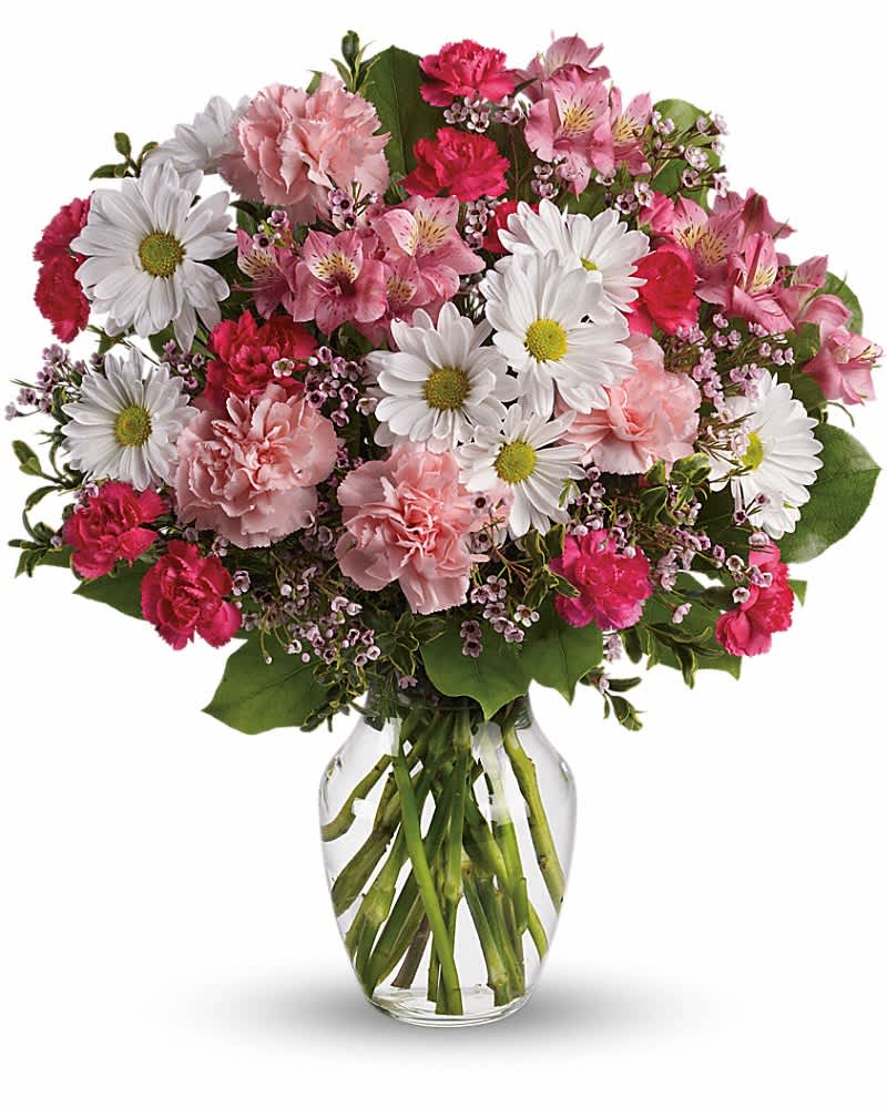 Teleflora's Sweet Tenderness - Let the family know they are in your thoughts and prayers with this beautiful gift of pink and white floral favorites. It will help ease their pain of loss. The beautiful bouquet includes pink alstroemeria, pink carnations, hot pink miniature carnations, white daisy spray chrysanthemums and white waxflower, accented with assorted greenery. Delivered in a clear glass rose vase.