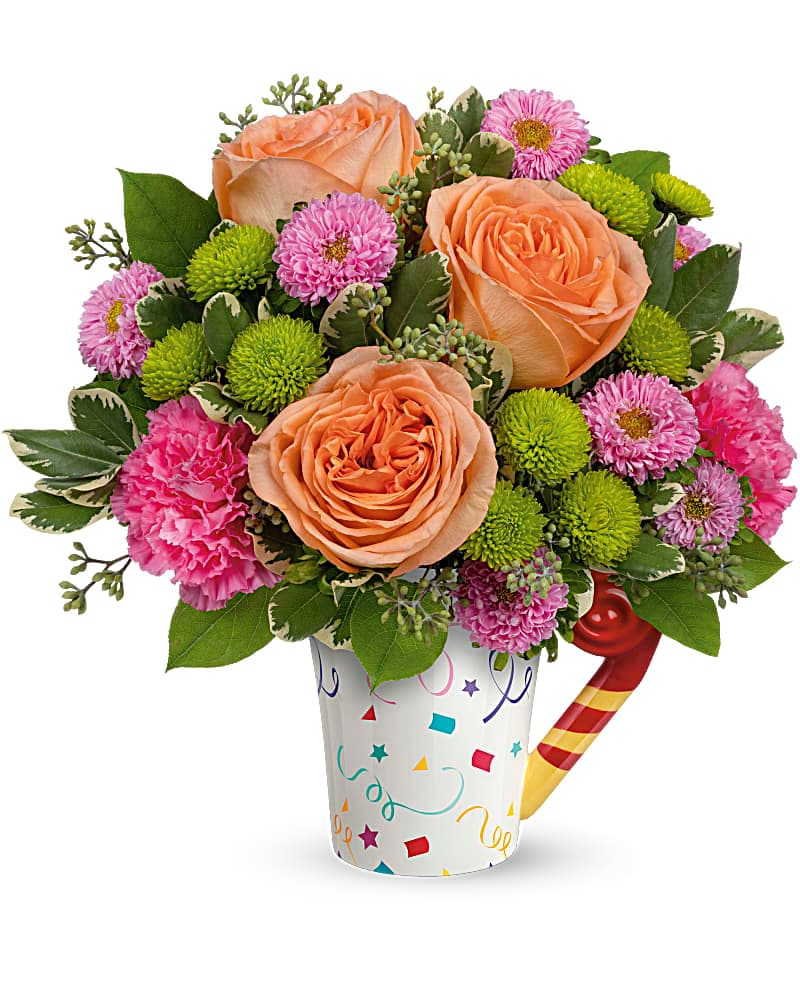 Teleflora's Time To Celebrate Bouquet - -We do not carry the ceramic confetti-covered mug- Make their birthday one to remember with a surprise bouquet of radiant roses presented in a clear vase! This fun bouquet features peach roses, pink matsumoto asters, green button spray chrysanthemums, dark pink carnations, variegated pittosporum, lemon leaf and seeded eucalyptus.