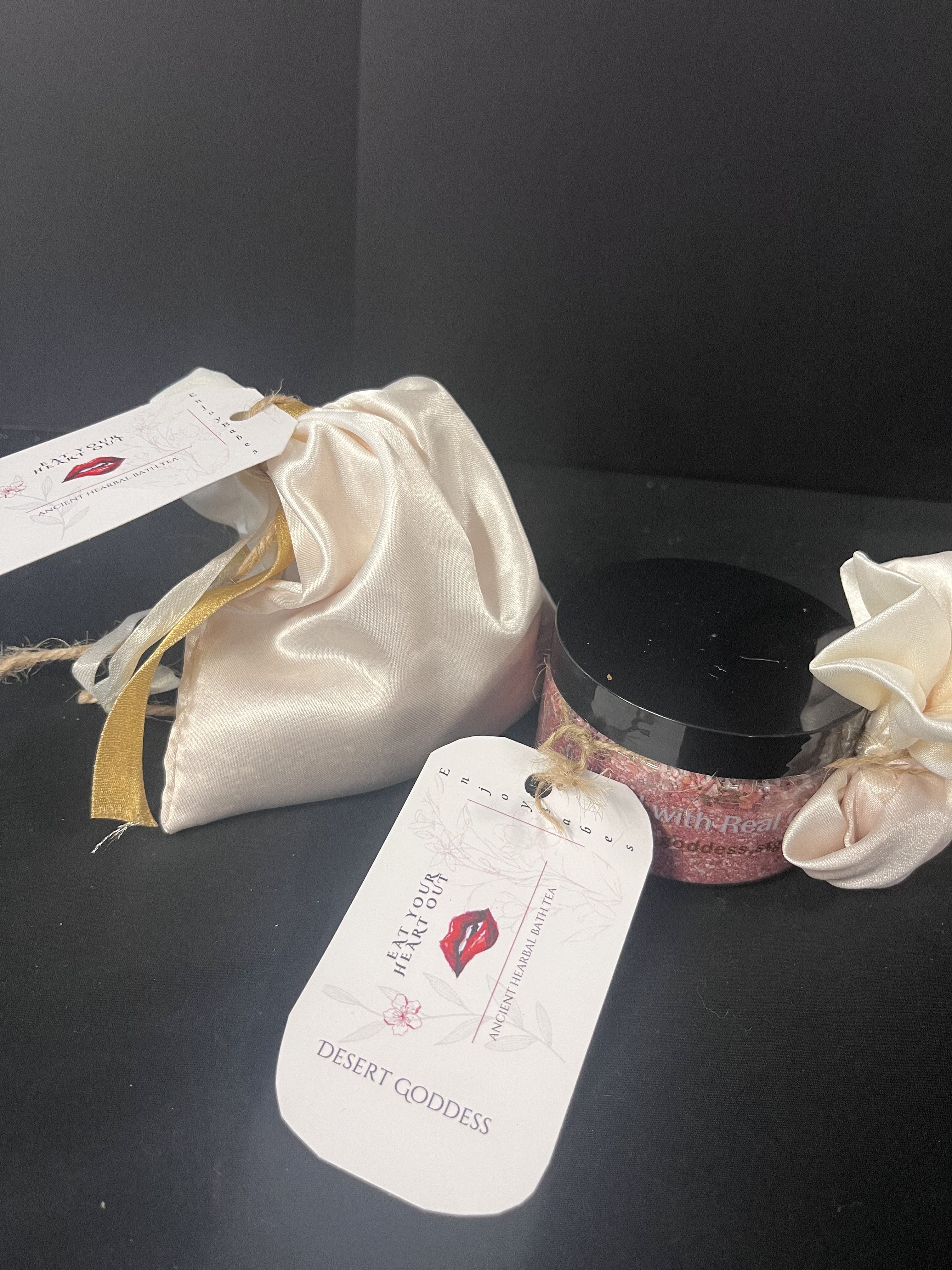 Desert Godess Bath Salts - A beautiful, unique scent. Curated especially for relaxing, whether in a bath or soaking your feet. Ingredients include epsom salts, beet root powder, oat powder ,cactus powder, rose petals, and essential oils. Your order will include one container of salts and a satin bag for immersion in the bath.