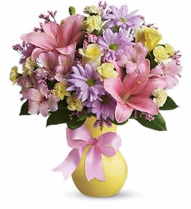 Yellow vase that's wrapped in a pretty pink satin bow - Light yellow roses, pink asiatic lilies and alstroemeria, light yellow miniature carnations, lavender daisy spray chrysanthemums and pink limonium are gorgeously arranged in a pretty yellow vase, complete with a satin bow
