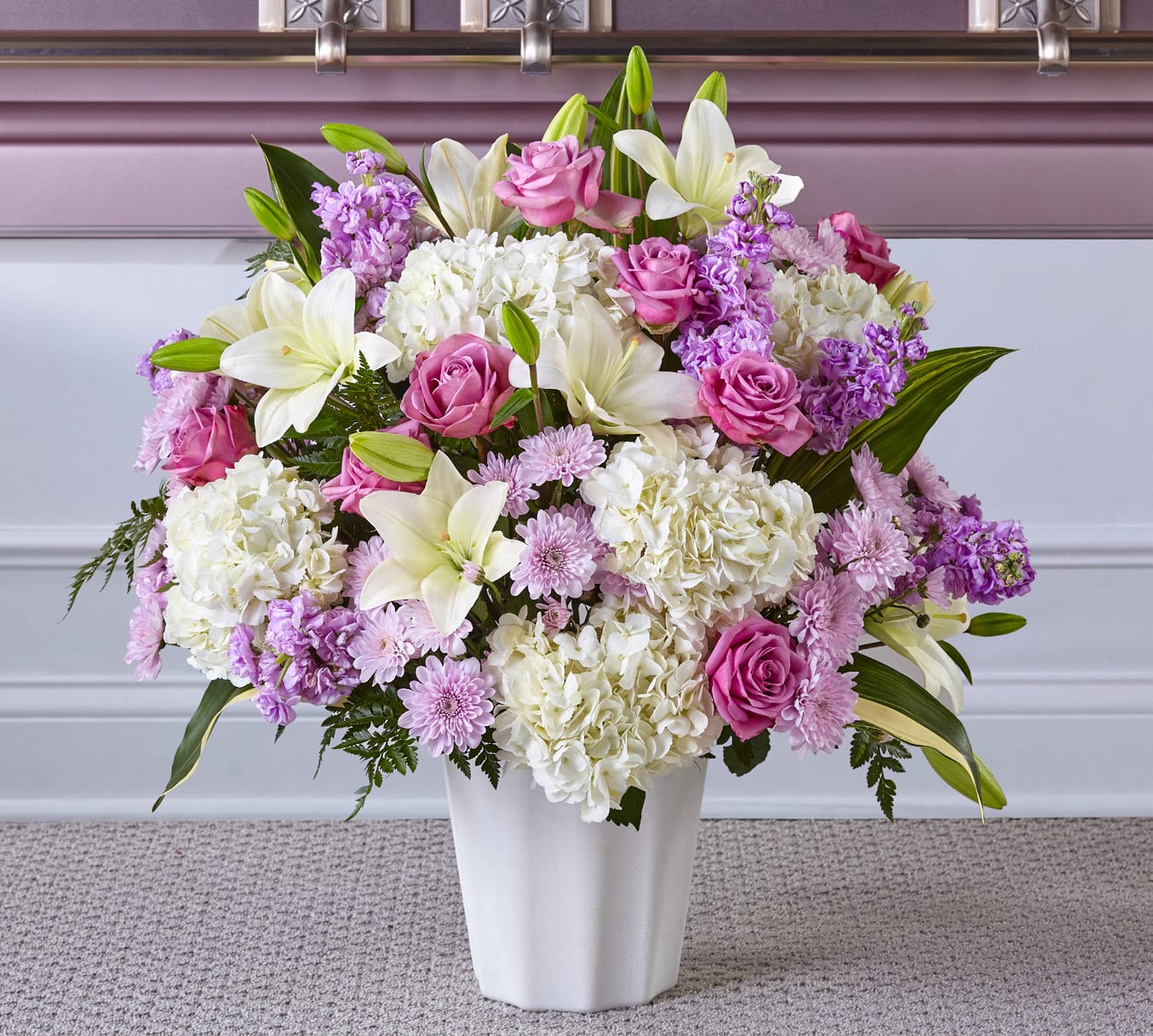 Heaven Sent Floor Basket - Blessings and prayers sent from above are captured in this stunning lavender and white arrangement. Each gorgeous bloom in our Heaven Sent Floor Basket is designed to bring solace during difficult times. While the lilies may initially arrive in bud form, they beautifully transform as they open.
