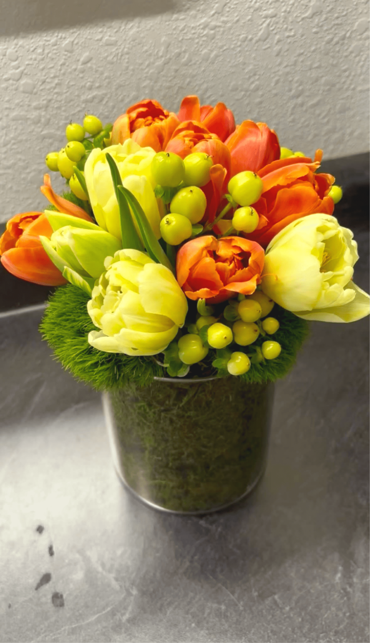 Morning Dew Boquette - Fresh, bright, and unique spring florals that are sure to bring cheer to the recipient.  Featuring a specialty double glass vase with live moss.   