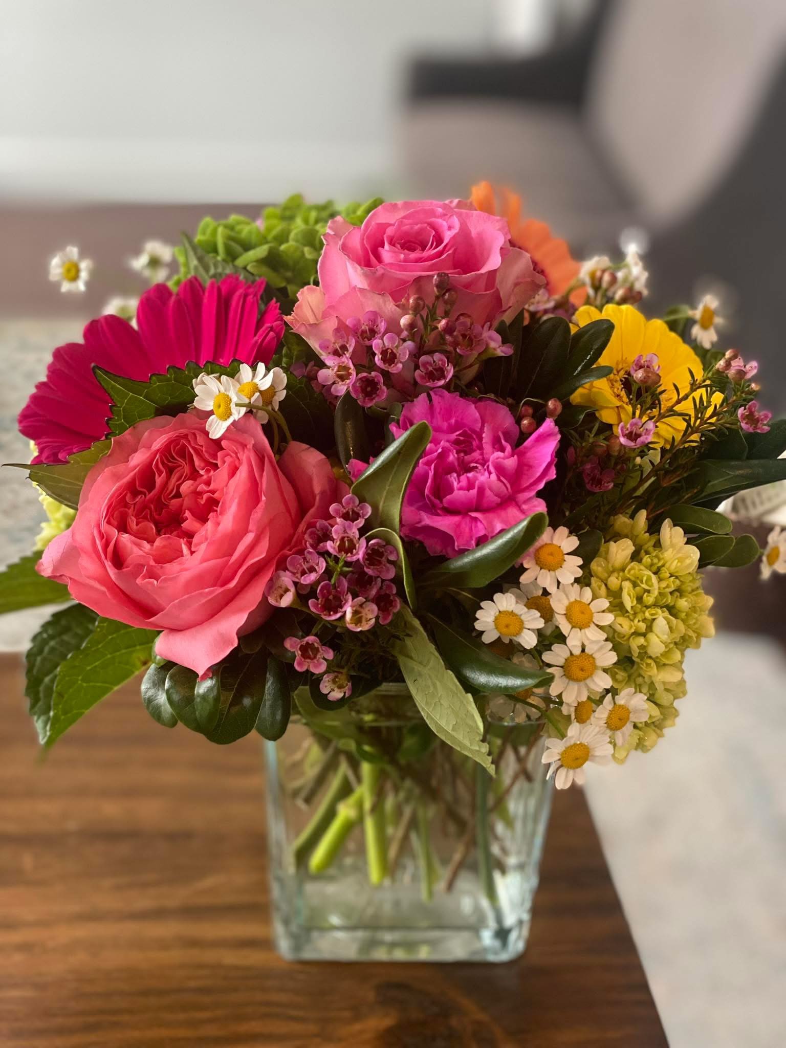 Something Special - A :Just Because" arrangement made with pink roses and matching filler flowers.