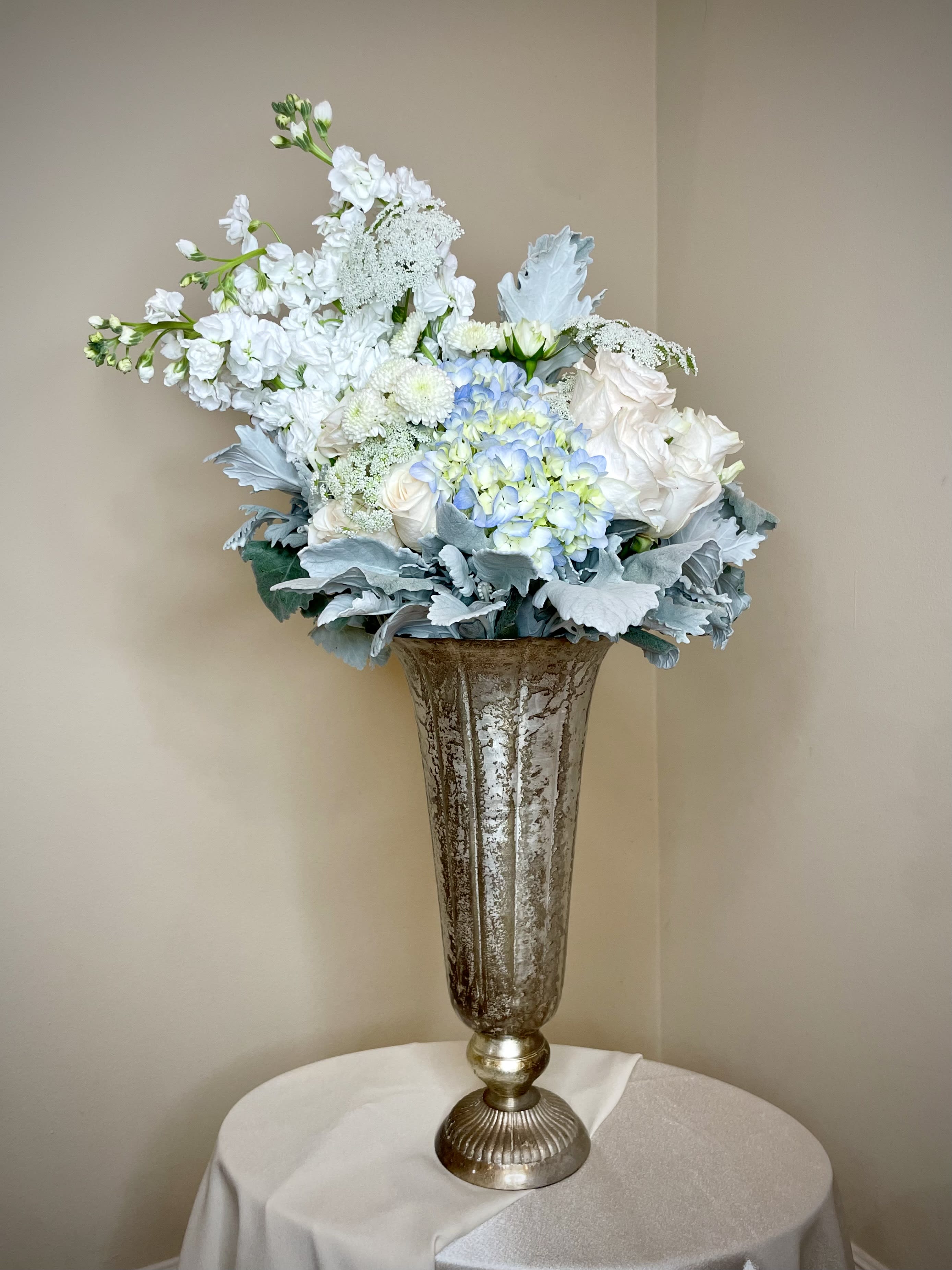Heaven - Designed as an extension of the Serenity Bouquet, this arrangement stands tall with grace. Artfully designed with tranquility in mind, the Heaven will bring warmth and peace to any space. Made using premium in season flowers. Final product may not have the exact blooms pictured but the overall look and feel will be the same. 