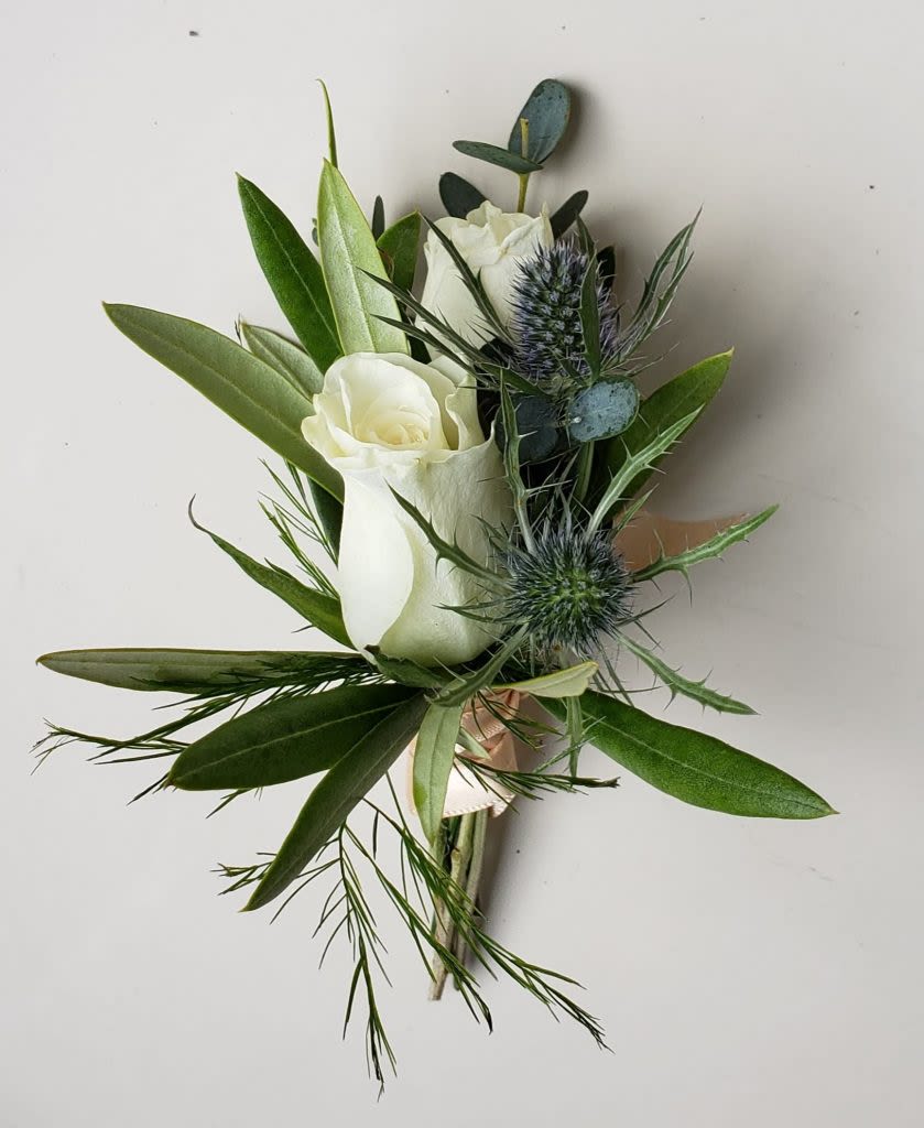  Classic Spray Rose Boutonniere - Classic Spray Rose Boutonniere  Simple, elegant, and timeless, our Classic Spray Rose Boutonniere is designed with delicate white spray roses and can be accented in any color to complement your event’s style. Whether you're going for a soft, romantic look or something bold and vibrant, this boutonniere is a refined finishing touch for weddings, proms, or formal occasions.  Each piece is handcrafted with care to create a polished and modern look that pins easily onto a lapel.  Looking to match a specific color palette? We’ve got you covered! We can customize the accent flowers to suit your vision. Just call us at 360-688-6608 or leave your request in the “Special Instructions” box when ordering.  We proudly offer flower delivery in Olympia, WA, Lacey, WA, Tumwater, WA, and the surrounding areas—bringing fresh, stylish designs right to your door or event location.  Created by the designers at Specialty Floral Design, where every boutonniere is made with heart and artistry.