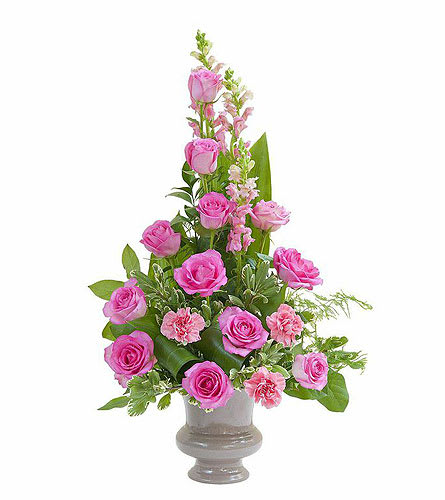 Pink roses and carnations in a gray vase